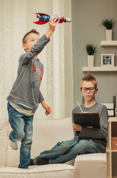 istock Happy young boy playing with his toy rocket 1349881304