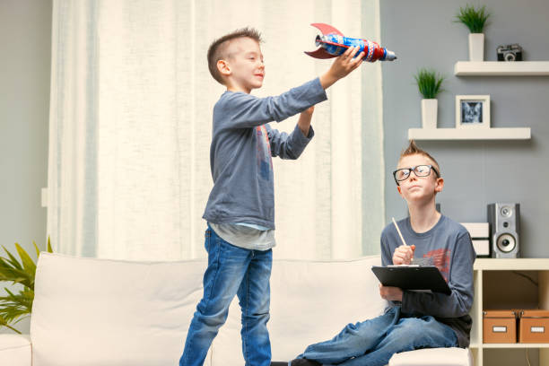 istock Young boy playing with a colorful toy rocket 1349881456