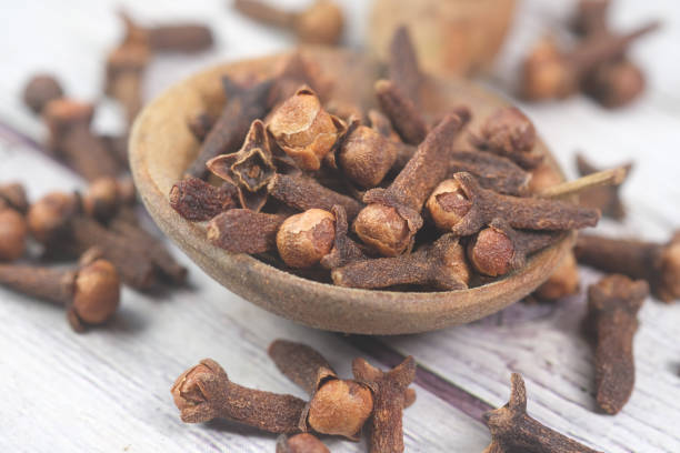 istock cloves on a spoon on table close up 1349883387