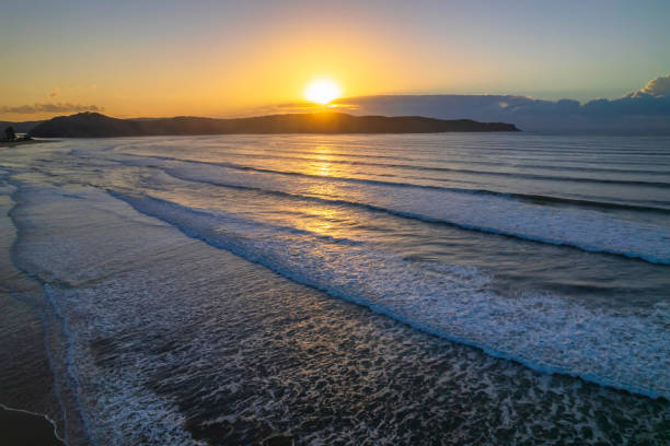 istock Aerial sunrise seascape with low cloud bank 1349887578