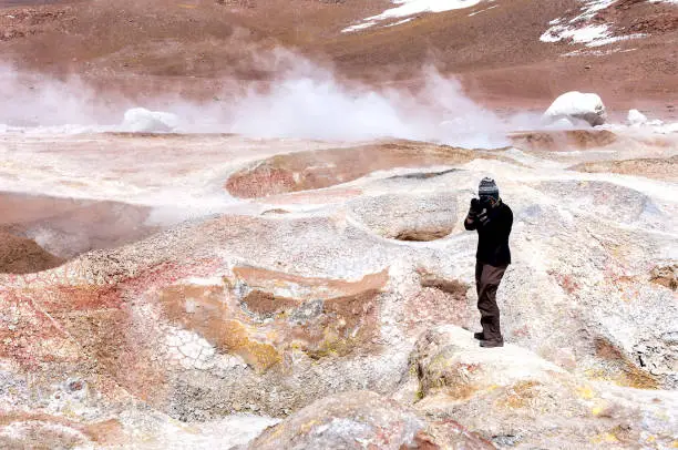 Woman visiting Sol de Manana, geysers and fumeroles, 5000 meters elevation, Resersva de Fauna Andina Eduardo Avarda, Southwestern Highlands, Bolivia, South America