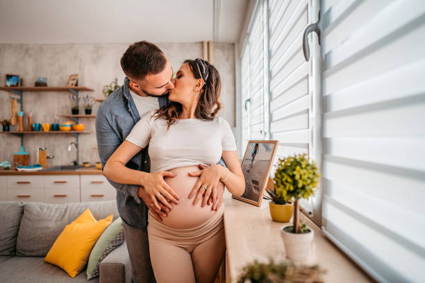 istock Young happy couple expecting baby 1349895446