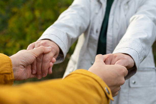 istock Mother & daughter holding hands 1349897440