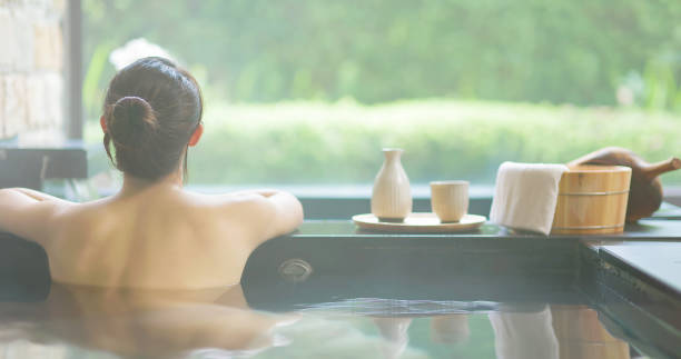 istock woman relax in hot spring 1349897509