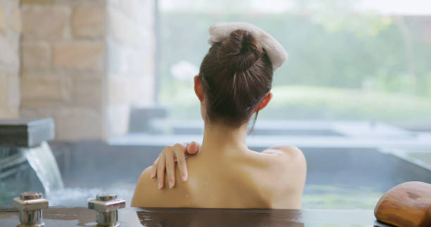 istock woman relax in hot spring 1349898211
