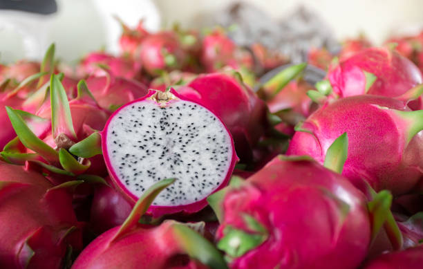 istock Dragon fruit that has been cut in half for product display. dragon fruit which are beautifully arranged in baskets to prepare for export sale. 1349898753