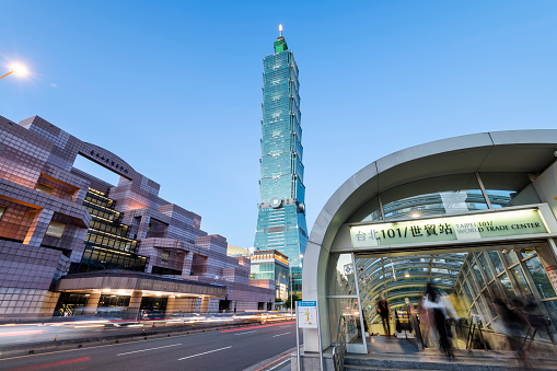 Low angle view of Taipei 101 skyscrapers in Taipei, Taiwan. the Xinyi District is a prime shopping area in Taipei, anchored by a number of department stores and malls.