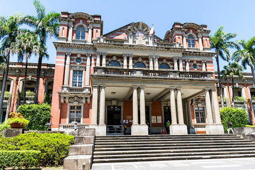 Taipei, Taiwan- August 26, 2021: During the coronavirus(COVID-19)  outbreak, People wearing a mask are going to the old wing of the National Taiwan University Hospital (NTUH) in Taipei.