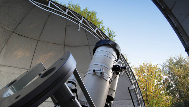 Optical telescope inside a dome of an astronomic observatory. Watching the space concept stock photo