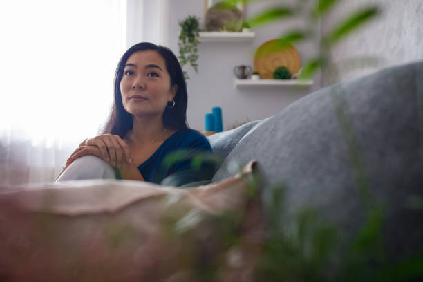 istock Just relaxing on the sofa, enjoying the time to contemplate 1349909013