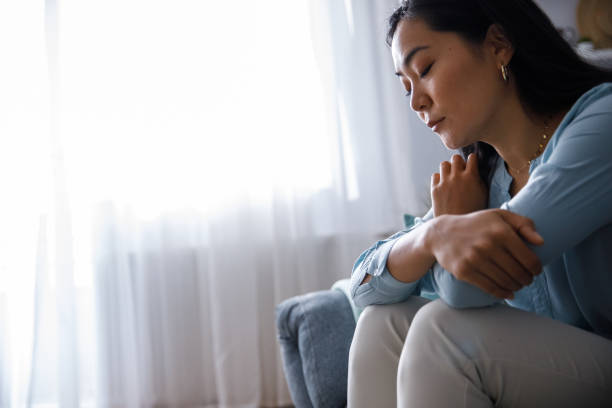 istock Hugging self in hope to stop feeling depressed 1349909128