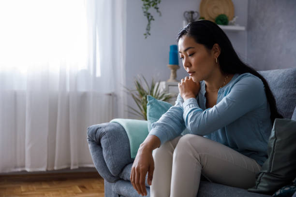 istock Young woman struggling with negative thoughts 1349909135
