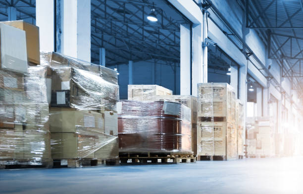 istock Package Boxes Wraaped Plastic Film on Pallets in Storage Warehouse. Supply Chain. Storehouse Cargo Shipment. Shipping Warehouse Logistics. 1349910229