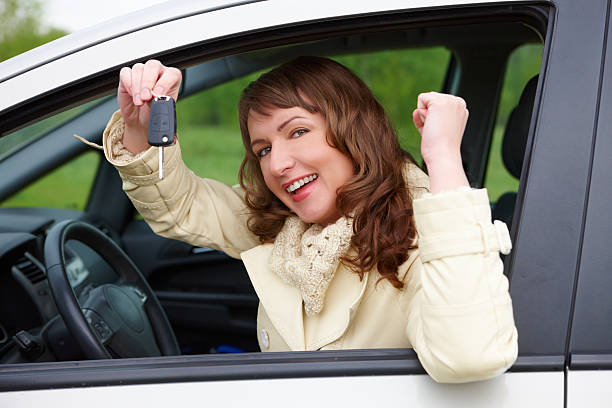 istock Cheerful woman showing car keys 134991029