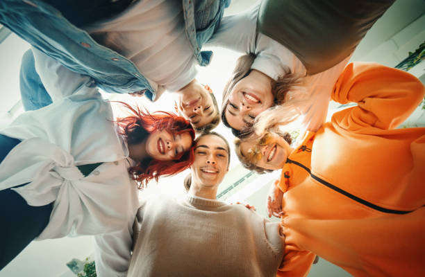 istock Highschool students in a huddle looking at the camera. 1349912312
