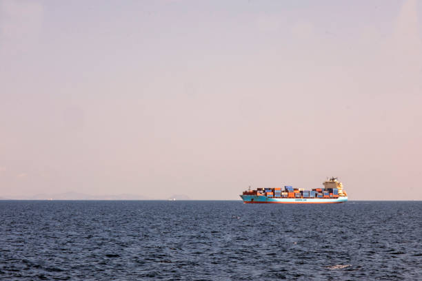 Piraeus, Athens, Greece - 09.29.2021: Transportation concept. Greek ferry series. Different cargo and passenger ships. High speed catamaran traveling and connecting Aegean Islands with main land. Nautical background with copy space