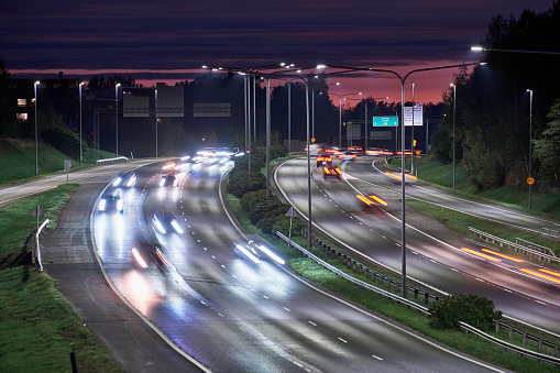 The highway traffic in the summer night in Espoo, Finland.