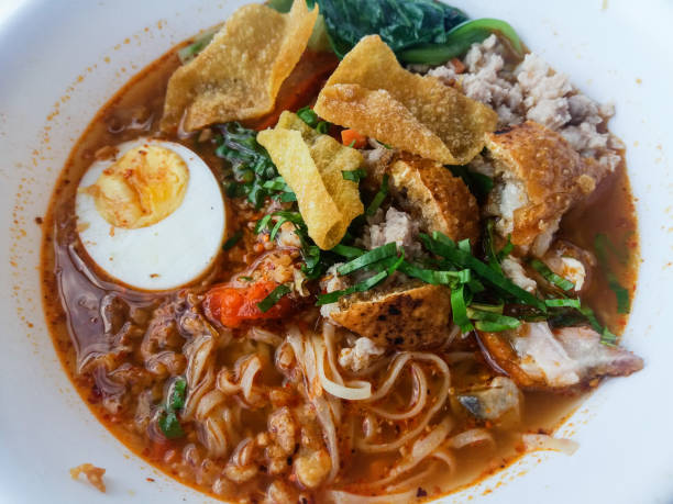 istock Traditional Laos red coconut curry noodle soup called Khao Poon 1349926078
