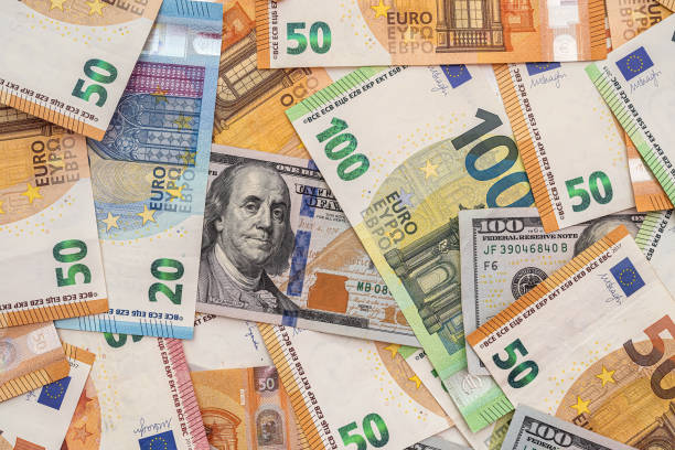 istock different euro and dollar banknotes, finance background 1349928834