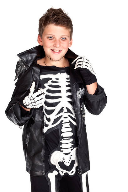 istock Caucasian boy wearing skeleton halloween costume on white background. 134993061