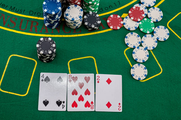 istock chips and cards for playing poker lie on the table, casino 1349936563