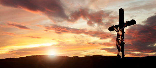 istock Crucifix cross at sunset background, crucifixion of Jesus Christ 1349937708