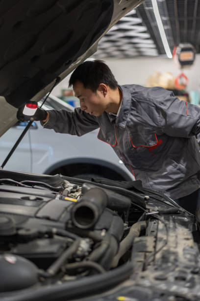 istock An automotive engineer holds a flashlight to inspect the car engine compartment 1349942078