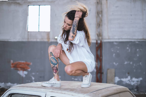 Girl with tattoo perhaps being arrested