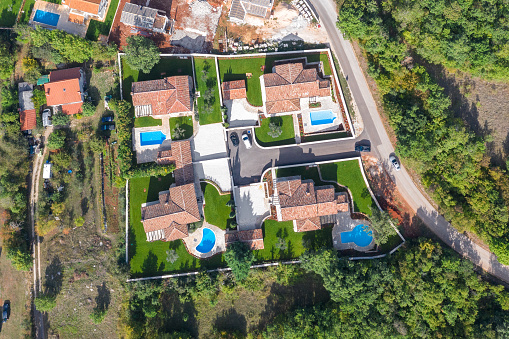 Luxurious beautiful modern villas with swimming pools and yard gardens, aerial view, Istria, Croatia