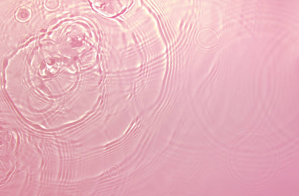 istock pink transparent clear water surface texture summer background 1349945687