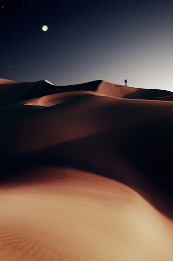 Full frame of sunrise casting shadows over uniquely smooth shaped golden desert sand dunes in Western Australia.