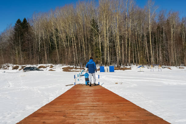istock Little boy with father on pier in winter. 1349954615