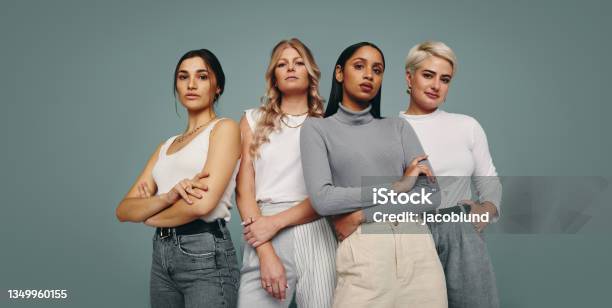 Group Of Fashionable Women Standing In A Studio Stock Photo - Download Image Now - Women, Only Women, Group Of People