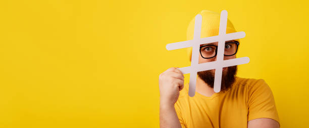 istock stylish bearded man in glasses looking into hashtag 1349960420
