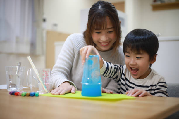 istock Parent and child making slime 1349961909
