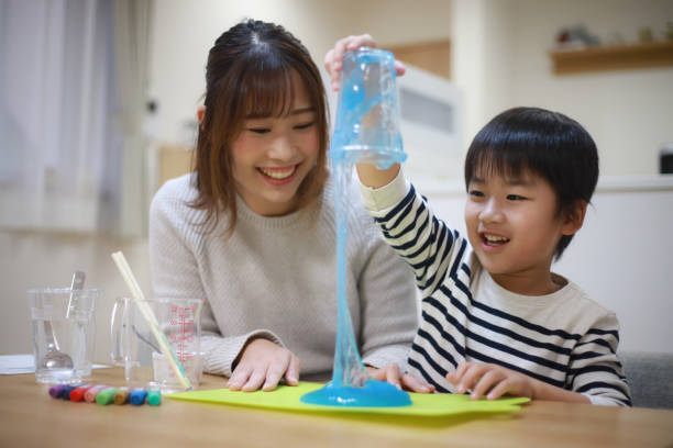 istock Parent and child making slime 1349961914