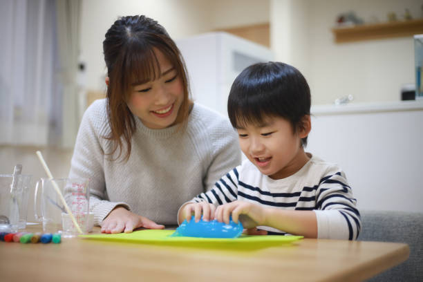 istock Parent and child making slime 1349961928
