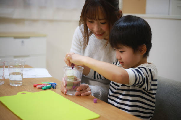 istock Parent and child making slime 1349962036