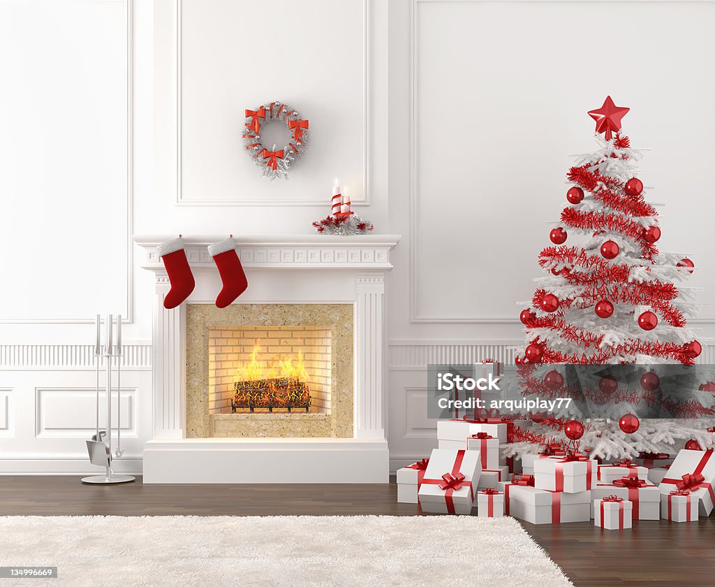 white and red christmas fireplace interior modern style interior of fireplace with christmas tree and presents in white and bright red Fireplace Stock Photo