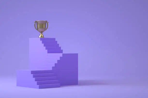 Photo of Trophy on ladder of success, business success concept