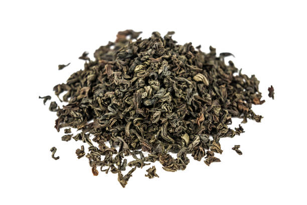 istock heap of green healthy tea on white 1349974076