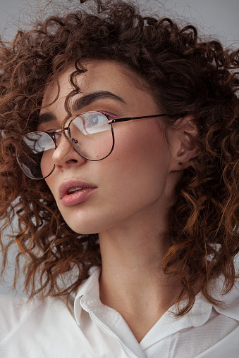 Closeup portrait of beautiful woman wearing spectacles