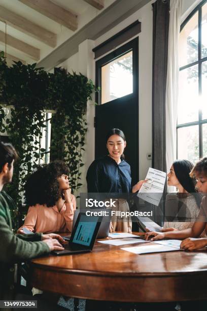 Business Meeting Of Young Adult People In A Modern Loft Stock Photo - Download Image Now
