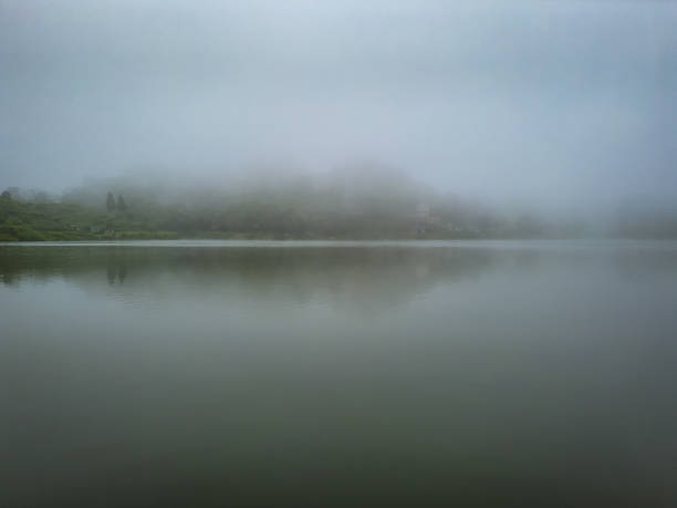 istock misty lake with water reflection view at early morning from flat angle 1349975552