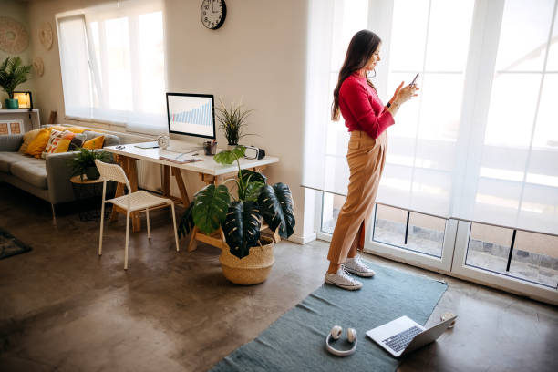 istock Young female freelancer working in loft office 1349977992