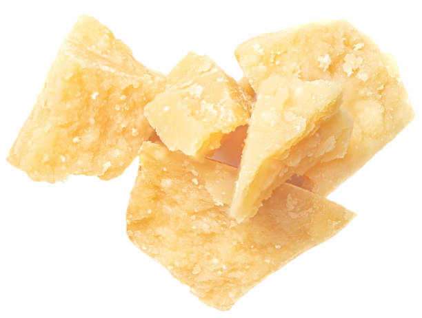 istock Parmesan cheese (Parmigiano, Grana)  isolated on white background.  Hard mature cheese, pile, top view.