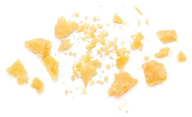 istock Parmesan cheese  crumbs (Parmigiano, Grana)  isolated on white background.  Flat lay, top view.