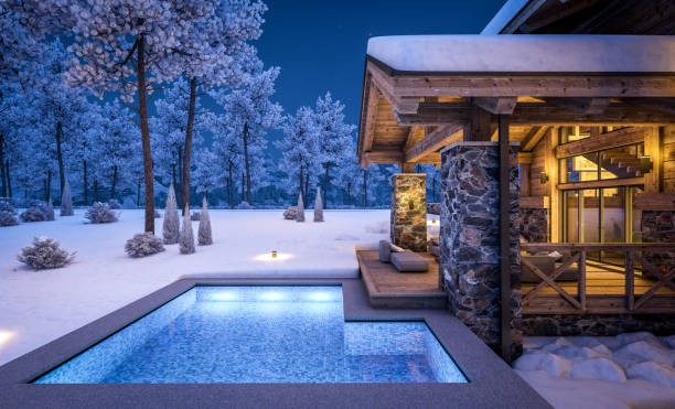 istock 3d rendering of modern cozy chalet in winter night 1349982652