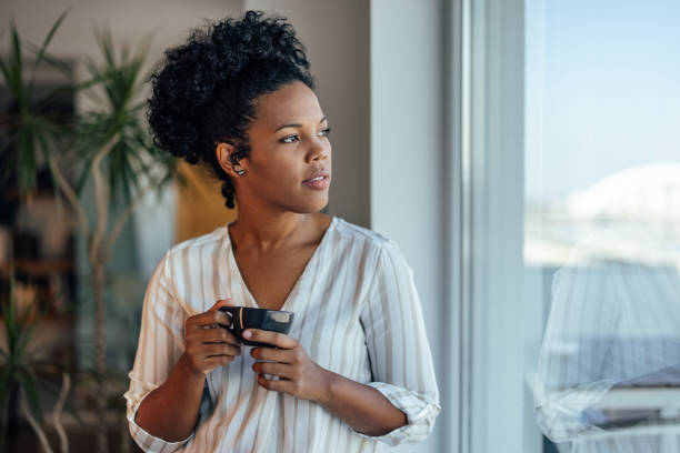 istock Serious woman, enjoying her warm drink 1349984497
