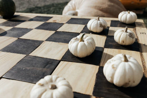 istock Halloween pumpkins on chess board, fall decoration 1349986955